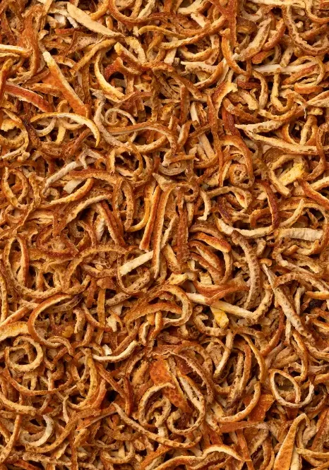 Curled dried bitter orange peel strips (Citrus aurantium) with golden-orange coloring.